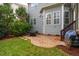 Charming brick patio with an outdoor seating area, providing an ideal space for relaxing and entertaining at 812 Long Meadows Rd, Chapel Hill, NC 27516