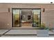 Back porch with sliding glass doors leading to a dining area with modern furniture at 813 N Mangum St, Durham, NC 27701