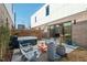 Modern backyard with a hot tub, lounge chairs, decorative planters, and privacy fencing at 813 N Mangum St, Durham, NC 27701