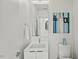 Bright and clean half bathroom featuring modern art, white fixtures, and minimalist design at 813 N Mangum St, Durham, NC 27701