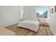 Bright bedroom with tall ceilings, large windows, and minimalist decor at 813 N Mangum St, Durham, NC 27701