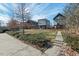 Exterior shot of modern townhomes with manicured lawns, landscaping, and sidewalks at 813 N Mangum St, Durham, NC 27701