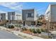 Modern two-story home with gray and brick facade and manicured front yard in a residential neighborhood at 813 N Mangum St, Durham, NC 27701