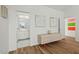 Hallway with stylish storage and a glimpse into a bright bathroom with modern fixtures at 813 N Mangum St, Durham, NC 27701