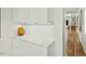 Hallway with ample storage, sleek countertops, and a view leading to the living spaces at 813 N Mangum St, Durham, NC 27701