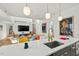 Open-concept kitchen with a large island, modern lighting, and colorful decor at 813 N Mangum St, Durham, NC 27701