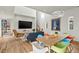 Bright living room with hardwood floors, modern lighting, and stylish furniture, perfect for entertaining at 813 N Mangum St, Durham, NC 27701