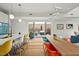 Bright living space with modern lighting, stylish seating, and access to outdoor patio with a jacuzzi at 813 N Mangum St, Durham, NC 27701