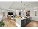 Open-concept living space with modern kitchen island, dining area, and comfortable seating at 813 N Mangum St, Durham, NC 27701