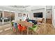 Open living space with hardwood floors, modern furnishings, and access to a private outdoor area at 813 N Mangum St, Durham, NC 27701