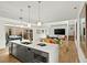 Bright living space with a modern kitchen, dining area, and sliding glass doors to an outdoor space at 813 N Mangum St, Durham, NC 27701