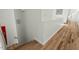 Staircase with hardwood floors, clean white walls, and minimalist design at 813 N Mangum St, Durham, NC 27701