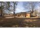 Large backyard area showing exterior brick, AC unit, and neighborhood at 817 S Brake St, Nashville, NC 27856