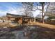 Backyard featuring a brick home, covered patio, and grass at 817 S Brake St, Nashville, NC 27856