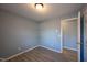 Cozy bedroom featuring modern gray walls, durable wood-look flooring, and a bright window at 817 S Brake St, Nashville, NC 27856