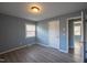 Sunlit bedroom featuring stylish gray walls, durable wood-look flooring and a bright window at 817 S Brake St, Nashville, NC 27856