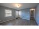 Bright living room featuring laminate floors, neutral paint, and natural light from a large window at 817 S Brake St, Nashville, NC 27856