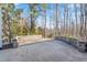 Paver patio in a backyard surrounded by trees at 86 Pappy Ln, Garner, NC 27529