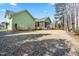 A backyard and lawn view of the green home at 86 Pappy Ln, Garner, NC 27529