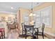 Bright breakfast nook featuring natural light, access to the back yard, and a view to the living room at 86 Pappy Ln, Garner, NC 27529