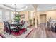 Elegant dining room with a round table, decorative rug, and natural light from shuttered windows at 86 Pappy Ln, Garner, NC 27529
