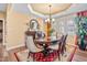 Elegant dining room featuring a chandelier, large windows, and tasteful decor for refined gatherings at 86 Pappy Ln, Garner, NC 27529