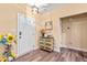 Bright entryway with a white front door, wood-look flooring, and decorative accents at 86 Pappy Ln, Garner, NC 27529