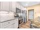 Modern kitchen with stainless steel appliances, granite countertops, and ample cabinet space at 86 Pappy Ln, Garner, NC 27529