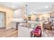 Updated kitchen with white cabinets, granite counters, stainless appliances and a breakfast bar at 86 Pappy Ln, Garner, NC 27529