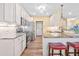Well-equipped kitchen with stainless steel appliances, granite countertops, and wood floors at 86 Pappy Ln, Garner, NC 27529