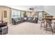 Relaxing living area with a plush sectional sofa, complemented by bar stool seating and inviting natural light at 86 Pappy Ln, Garner, NC 27529