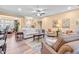 Inviting living room showcases a ceiling fan, a white sofa, and neutral walls at 86 Pappy Ln, Garner, NC 27529