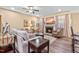 Cozy living room with a fireplace, plush seating, and ample natural light for a welcoming ambiance at 86 Pappy Ln, Garner, NC 27529