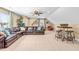 Large living room with a leather sofa, bar table, and stools, perfect for relaxation and entertaining at 86 Pappy Ln, Garner, NC 27529