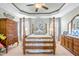 Inviting bedroom featuring a four-poster bed, ample natural light, and classic furniture at 86 Pappy Ln, Garner, NC 27529