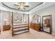 Bright main bedroom showcasing a four-poster bed, dresser, and large mirror at 86 Pappy Ln, Garner, NC 27529