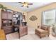 Home office with a dark wood desk, built-in shelving, and comfortable seating at 86 Pappy Ln, Garner, NC 27529