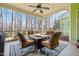 Relaxing screened-in porch with comfortable seating around a fire pit, perfect for enjoying the outdoors bug-free at 86 Pappy Ln, Garner, NC 27529