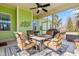 Inviting covered patio featuring a cozy fire pit and comfortable seating, ideal for outdoor relaxation at 86 Pappy Ln, Garner, NC 27529