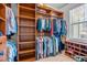 Spacious walk-in closet with custom wood shelving for organized storage at 86 Pappy Ln, Garner, NC 27529
