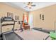 Spacious workout room with treadmill, stationary bike, weight bench and natural light at 86 Pappy Ln, Garner, NC 27529