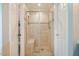 Bright bathroom featuring a tiled shower with a built-in bench at 8600 Paddle Wheel Dr, Raleigh, NC 27615