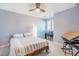 Bedroom featuring a bed, a desk with a piano, and a window at 8600 Paddle Wheel Dr, Raleigh, NC 27615