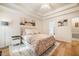Comfortable bedroom featuring neutral tones, tray ceilings, and bright, sun-drenched windows at 8600 Paddle Wheel Dr, Raleigh, NC 27615