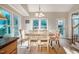 Bright dining area with large windows, hardwood floors, and stylish decor at 8600 Paddle Wheel Dr, Raleigh, NC 27615