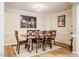 Chic dining room featuring modern lighting, neutral walls, and hardwood flooring at 8600 Paddle Wheel Dr, Raleigh, NC 27615
