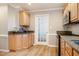 Updated kitchen features granite countertops, stainless appliances and wood floors at 8600 Paddle Wheel Dr, Raleigh, NC 27615