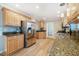 Gourmet kitchen with granite countertops and stainless appliances, perfect for cooking enthusiasts at 8600 Paddle Wheel Dr, Raleigh, NC 27615