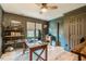 Office featuring a desk, shelves with books, and hardwood floors at 8600 Paddle Wheel Dr, Raleigh, NC 27615