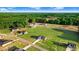 An aerial view showing multiple newly constructed homes in a community with ample green space and tree line at 9315 Turkey Way, Middlesex, NC 27557